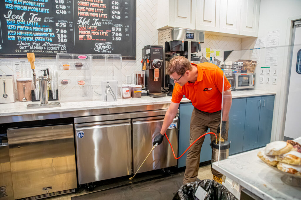Rock Pest technician treating a Kansas City workplace for bed bugs